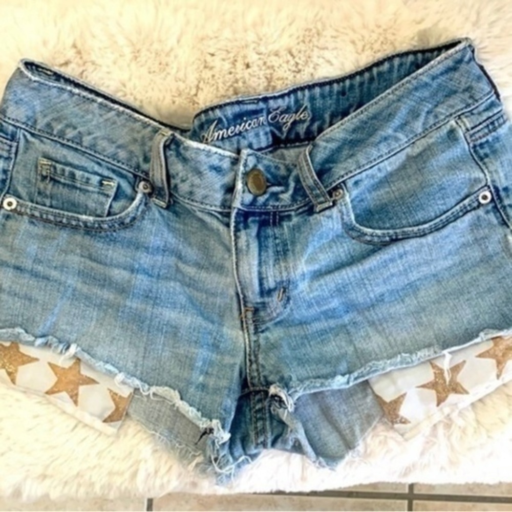 American Eagle denim shorties with star pocket hanging